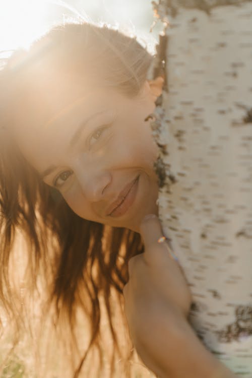 Woman in White Tank Top Smiling