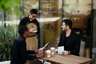 Waiter getting the Customer's Orders