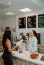 Barista Taking Orders from a Customer