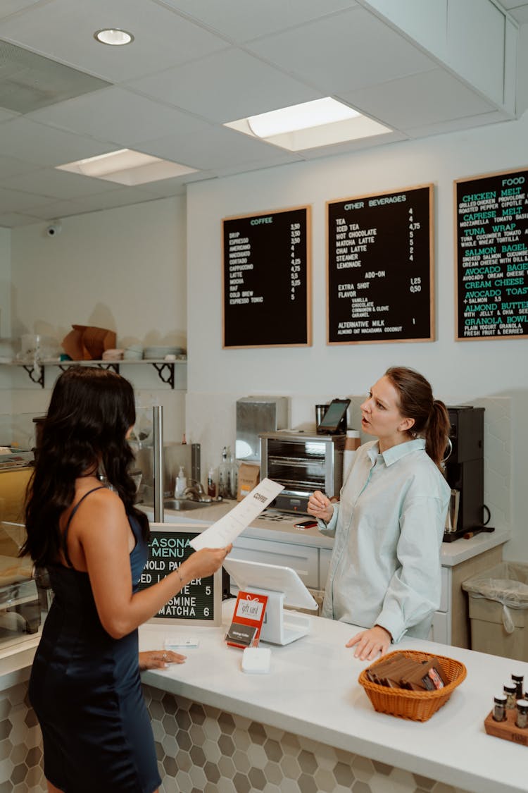 Barista Taking Orders From A Customer