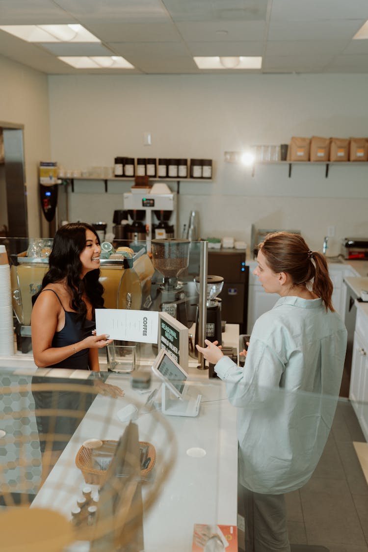 Barista Taking Orders From A Customer