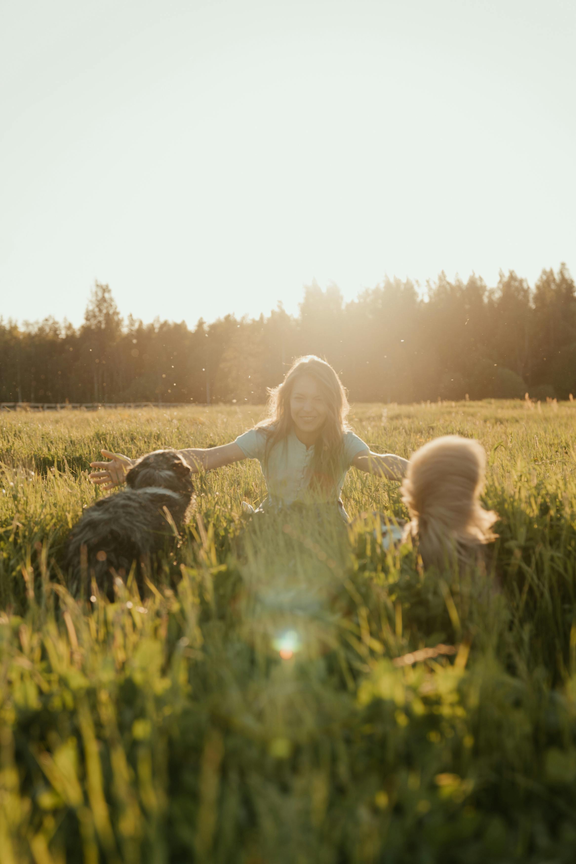 girl in white dress sitting on green grass field