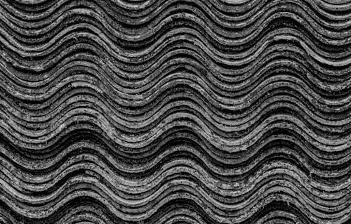 A Stack of Wavy Materials in Black and White