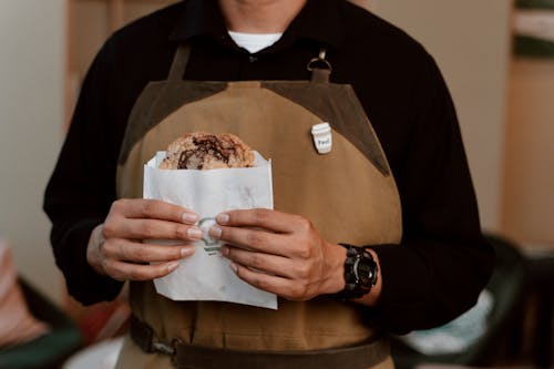 Free Close-Up Shot of a Person Holding Chocolate Chip Cookies Stock Photo