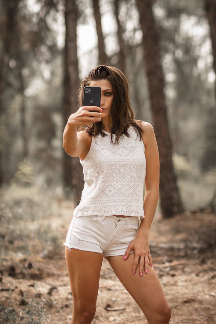 Stylish Woman Taking Selfie In Park