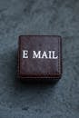 A Brown Leather Box with E-Mail Label