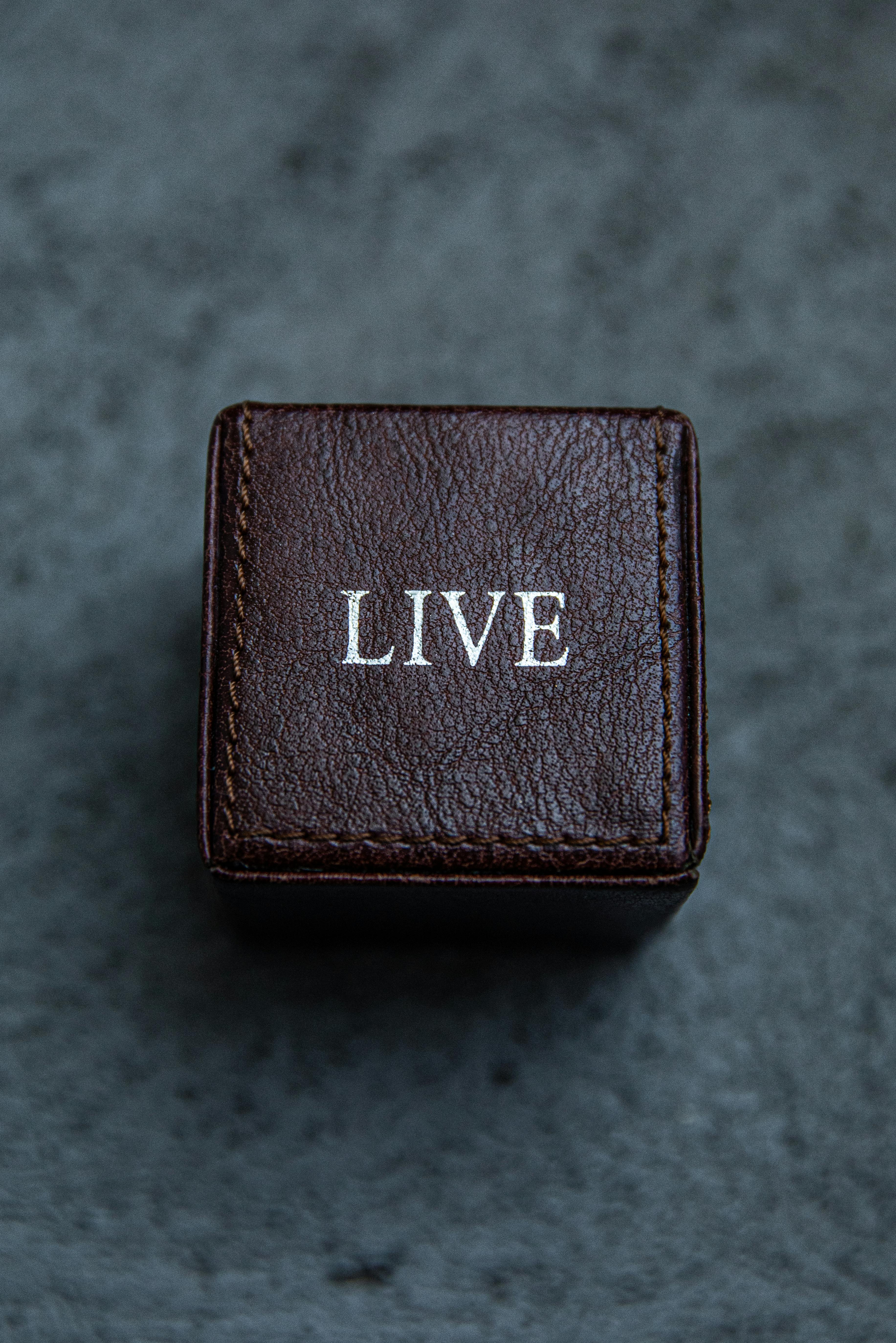 close up photo of brown leather box