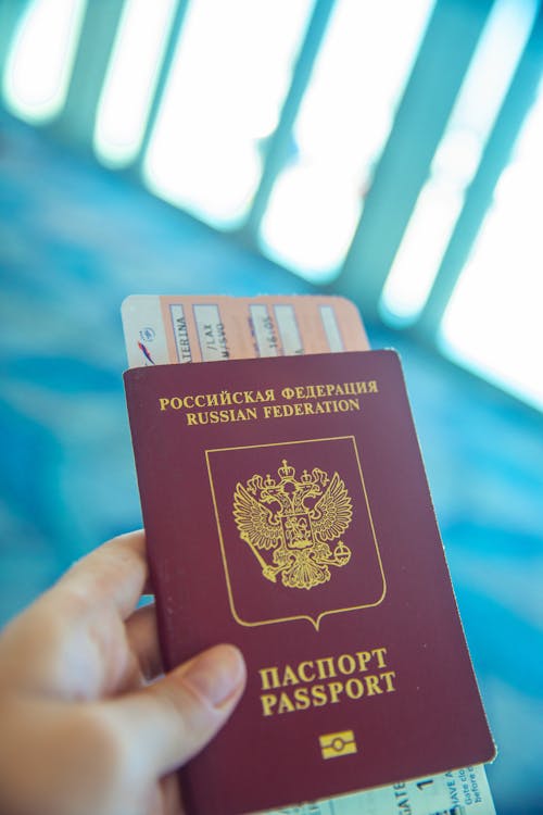 Free Person Holding a Passport  Stock Photo