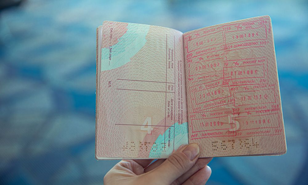 kenya immigration officer stamping passport at nairobi airport