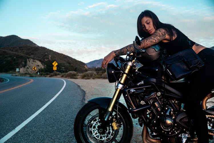 Woman Sitting On A Motorcycle