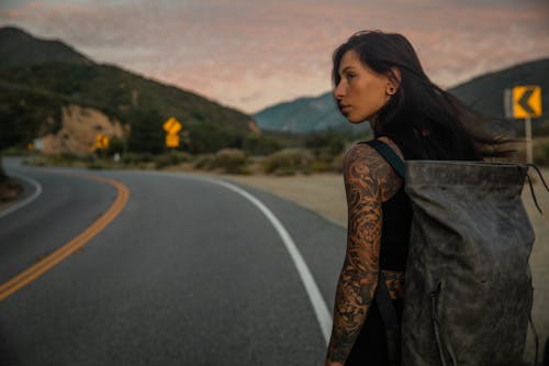 Woman Carrying a Backpack