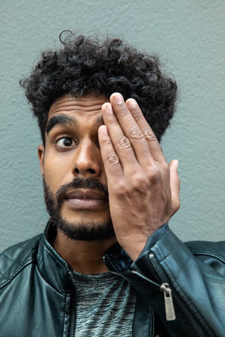 Man's Hand Covering His Eye