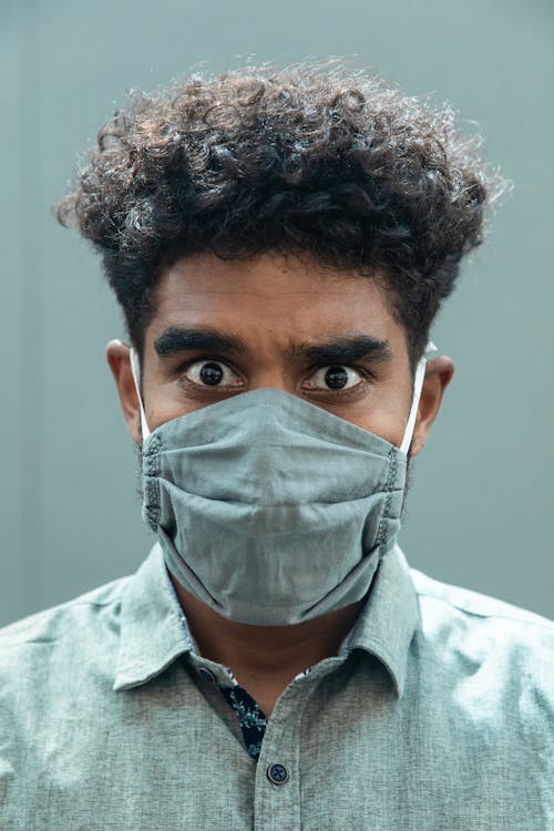 Man in Gray Button Up Shirt Wearing Face Mask