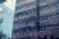 From below of title on dusty glass about fight for social rights and equality