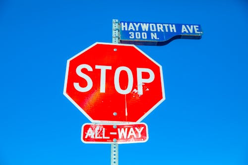 Free Stop Sign and Street Sign on a Post Stock Photo