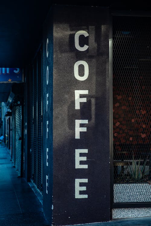 Free Coffee Signage on a Concrete Column Stock Photo