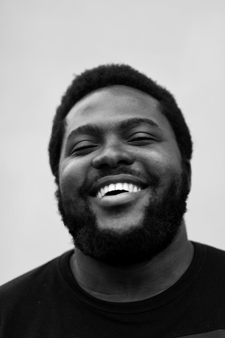 Happy Plump Black Man With Bright Smile