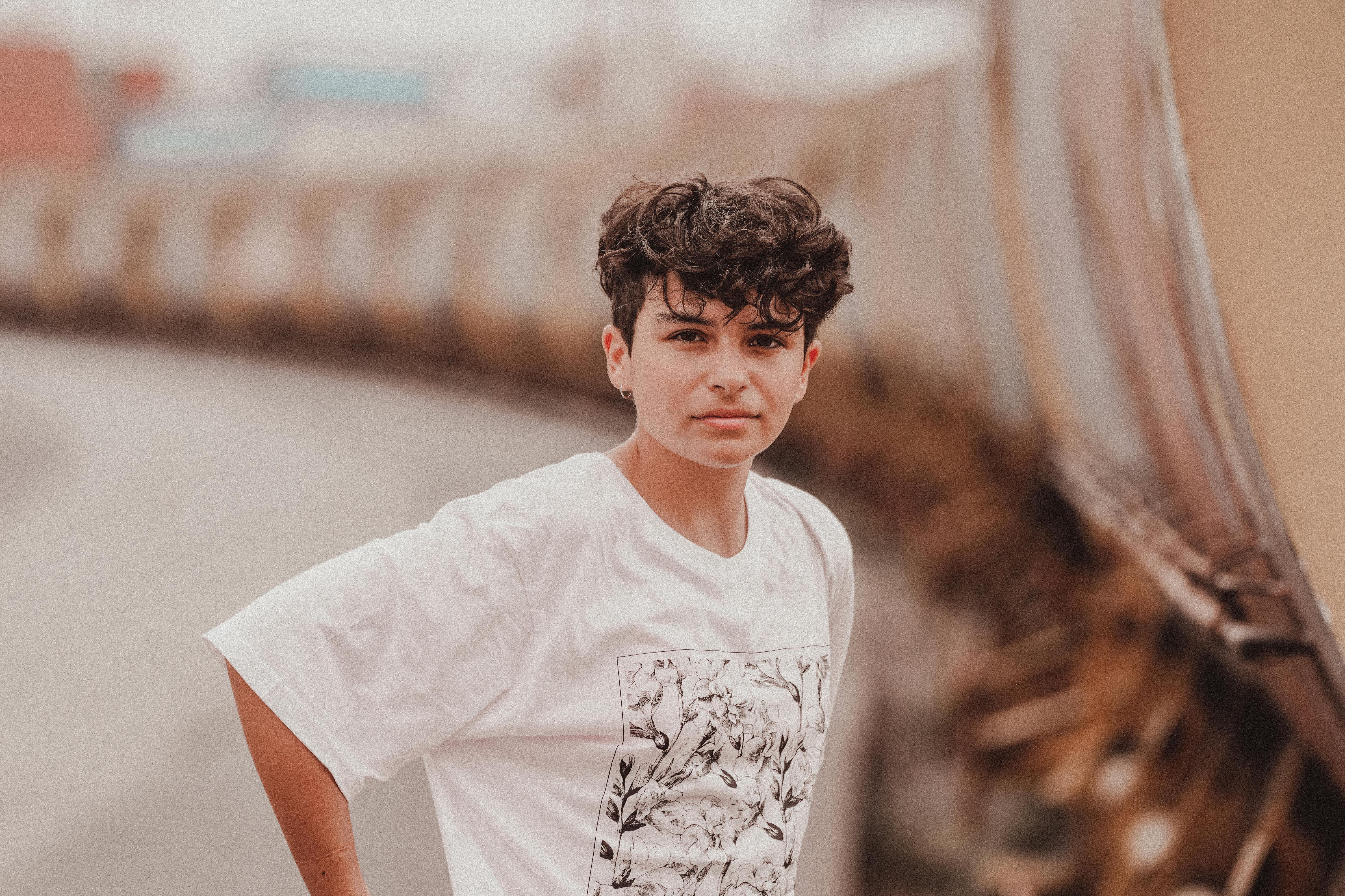 a short haired woman in white shirt