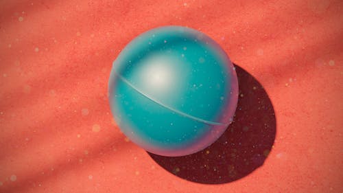 Free Blue Ball on Red Surface Stock Photo