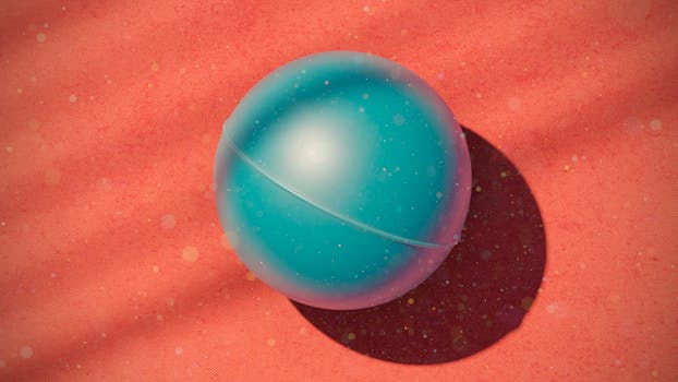 A textured blue ball casting a shadow on a bright red patterned surface.