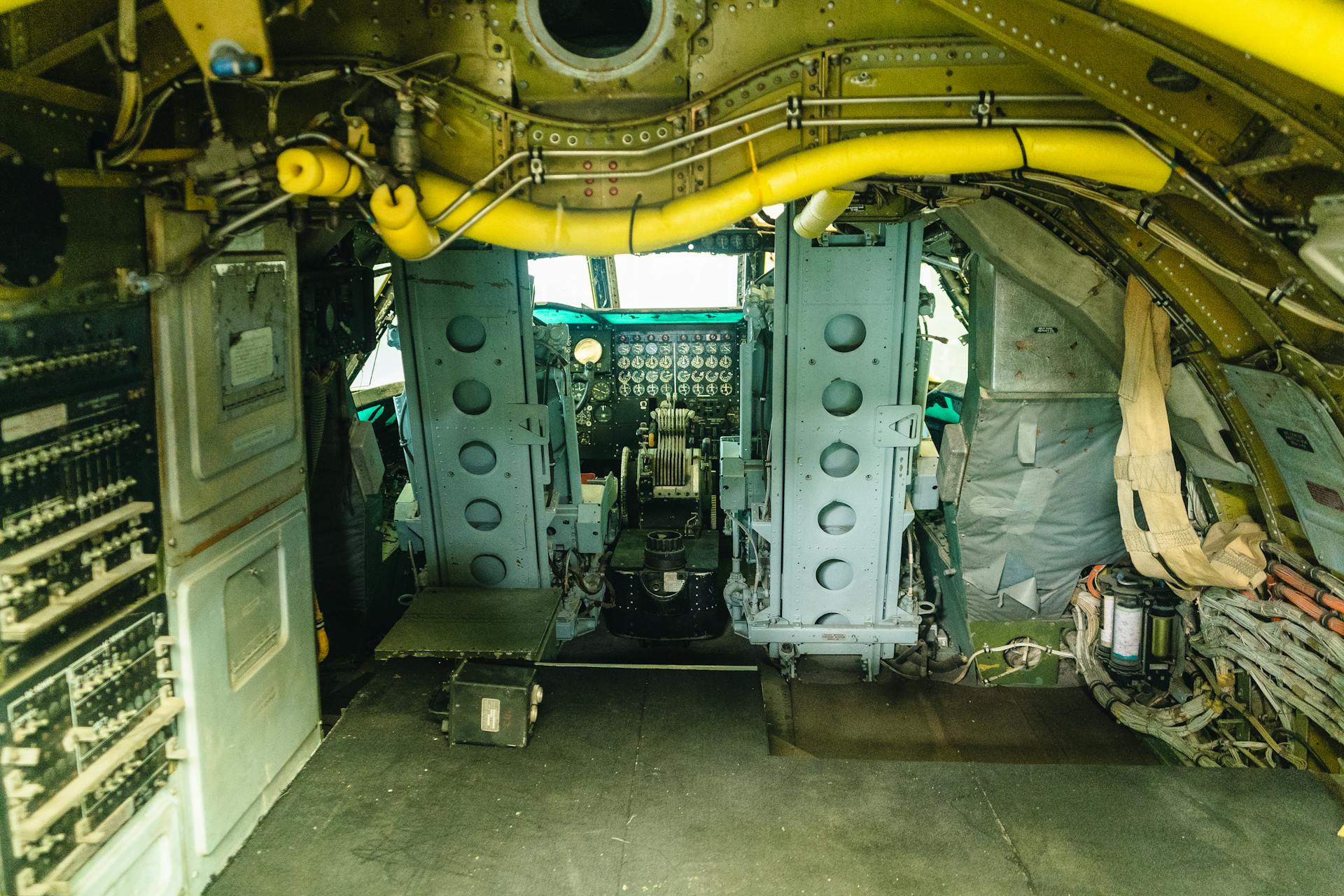 Explore a vintage aircraft cockpit showcasing mechanical dials and detailed interior design.