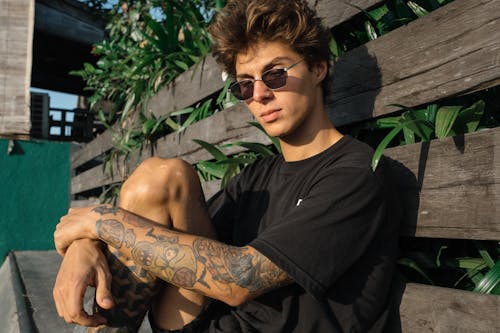 Young Man Sitting on Bench 