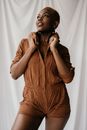 A Woman in Brown Romper while Looking Up