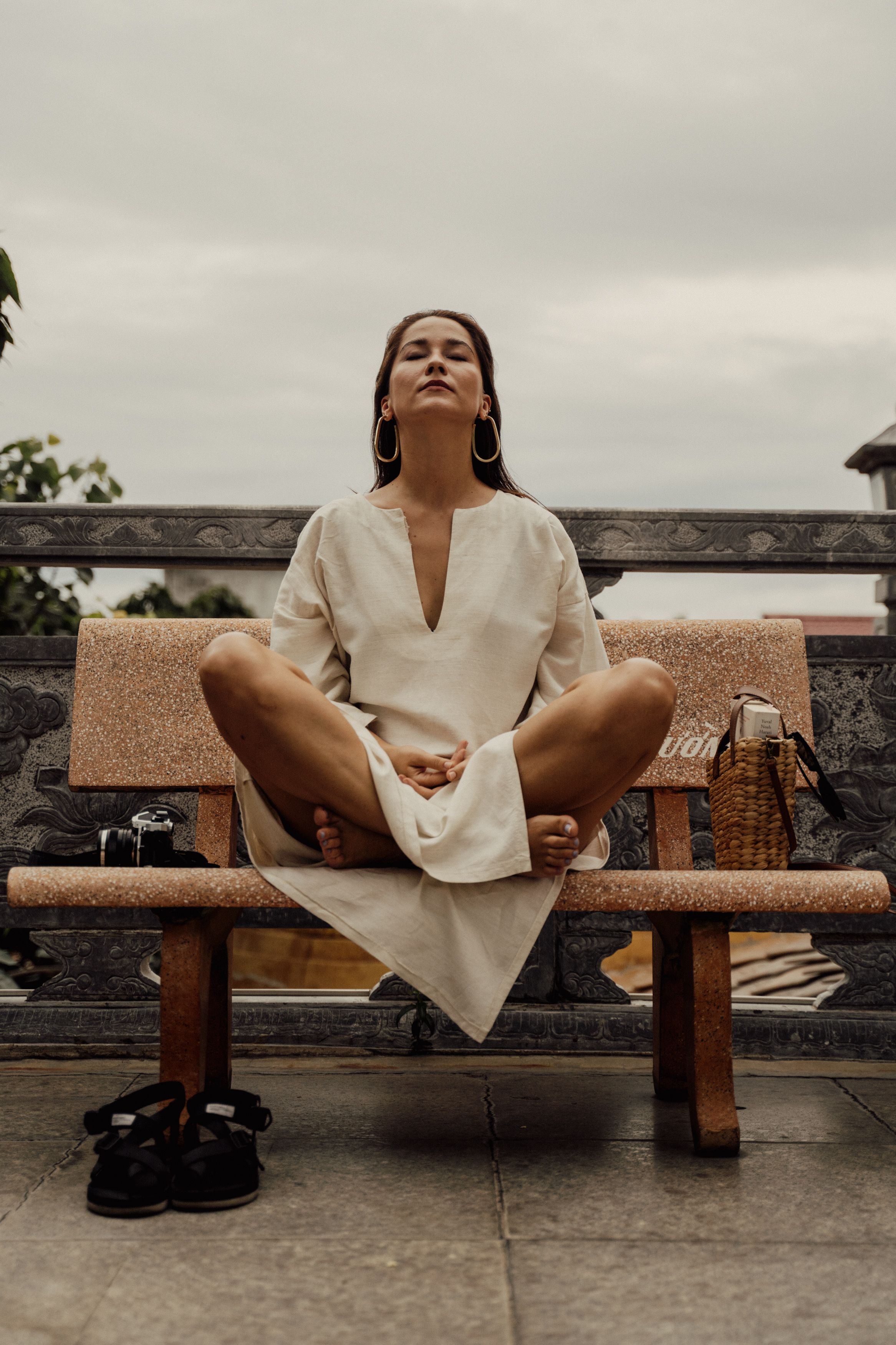 Woman in White Dress Sitting on a Bench · Free Stock Photo