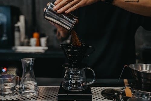 Free A Person Pouring Coffee Stock Photo