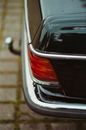 Black Car With Red and Silver License Plate