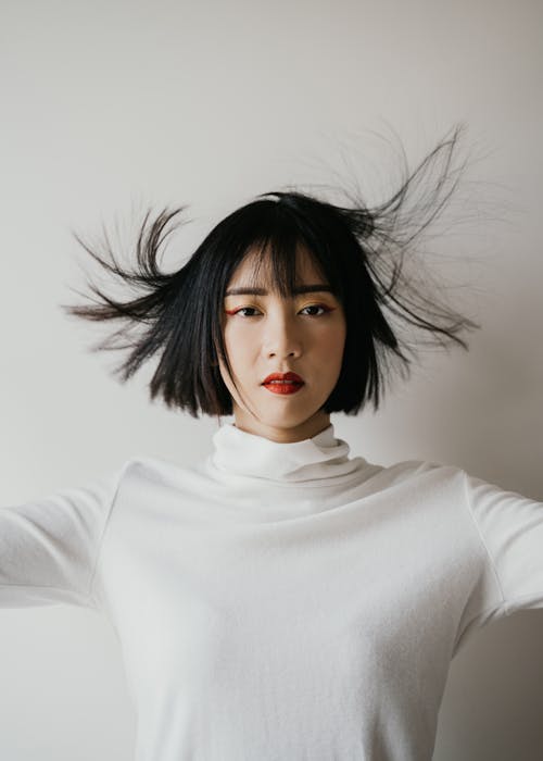 A Woman in White Long Sleeve Shirt