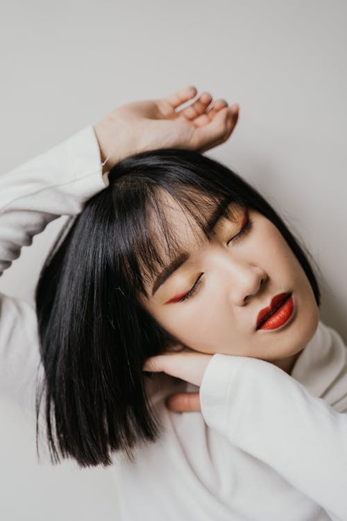 A Woman in White Long Sleeve Shirt