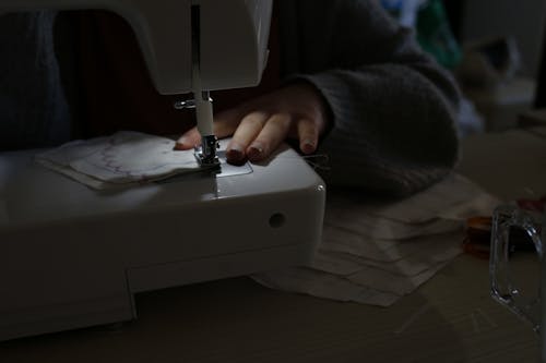 A Person Using a Sewing Machine