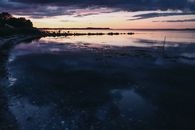 Body of Water Under Cloudy Sky
