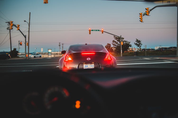 From Drivers Seat View Of Modern Car On Intersection