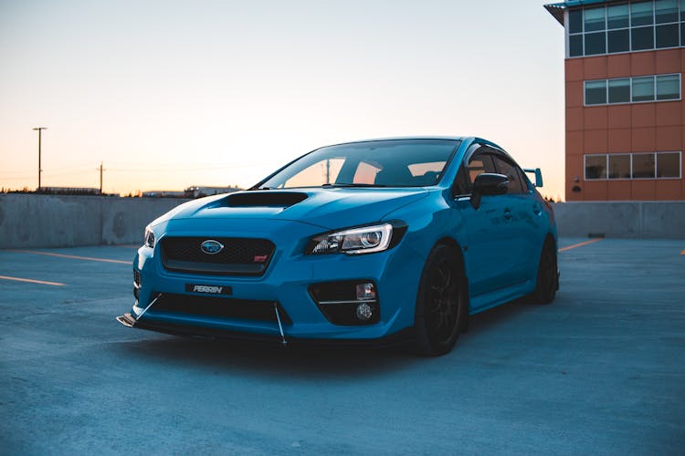 Exterior Of Blue Car On Parking Area