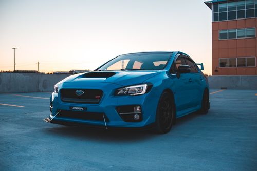 Free Modern sports car parked on outdoor parking area near residential building at dusk Stock Photo