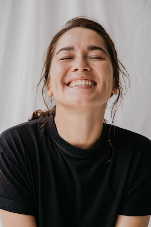Free Woman Eyes Closed While Smiling Stock Photo