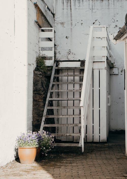 Free Run-down Little White Terrace with Steps and Storage Underneath  Stock Photo
