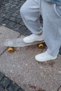 Person in Blue Denim Jeans and White Nike Sneakers