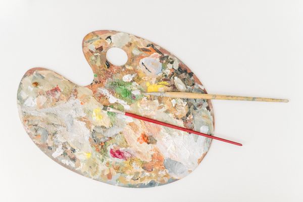 Artist palette with paint and brushes — Leeloo The First on Pexels