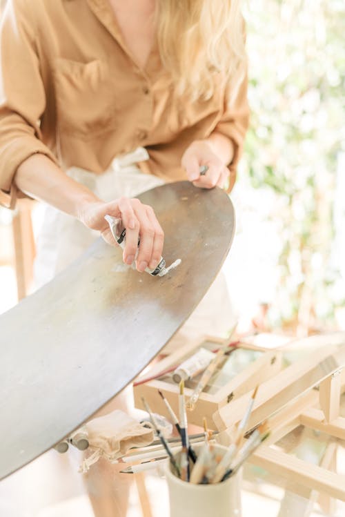 Woman Putting Paint on Palette