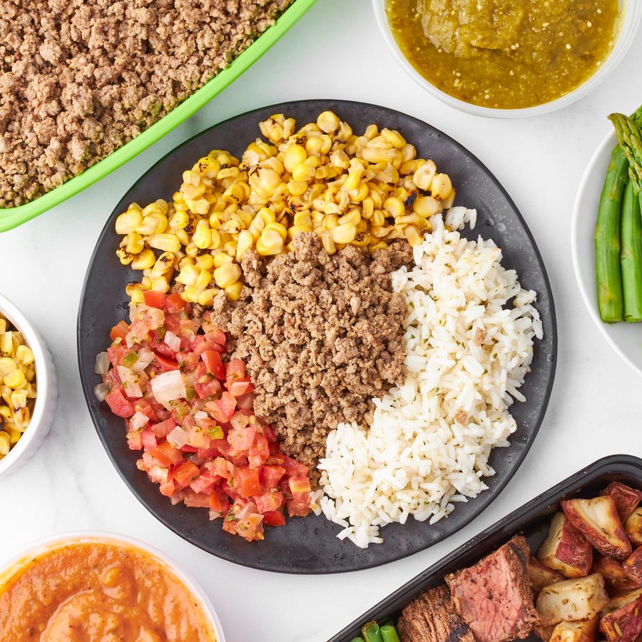 Mexican inspired ground beef bowl with rice corn and salsa