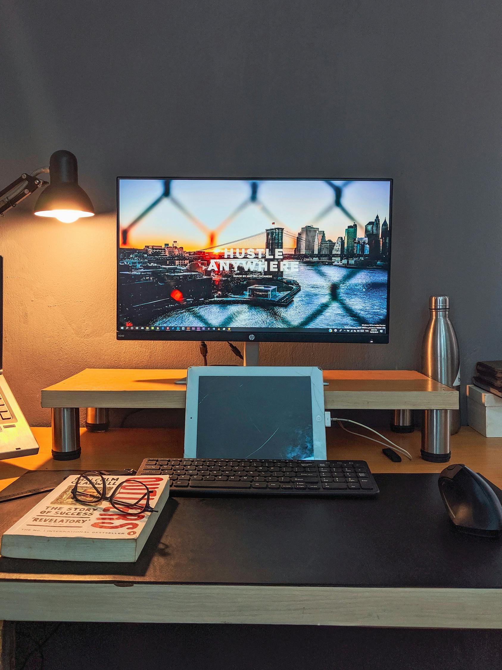 Computer Monitor in Creative Workspace · Free Stock Photo