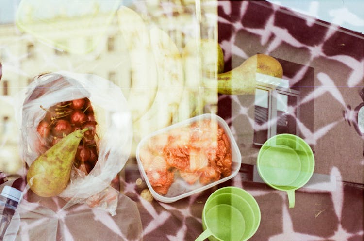 Ripe Fruits And Food In Container For Picnic