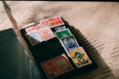 Collection of old stamps on blanket at home
