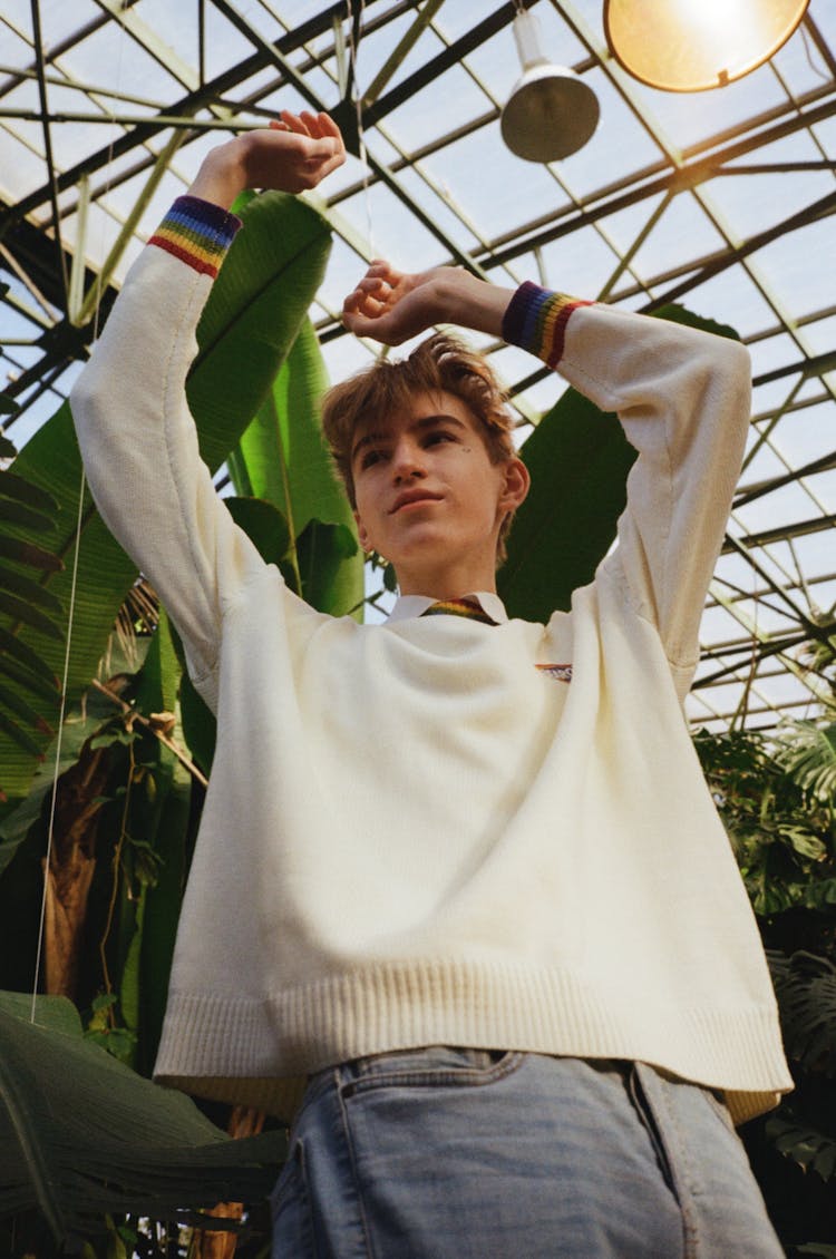 Excited Young Teenager Dancing In Greenhouse