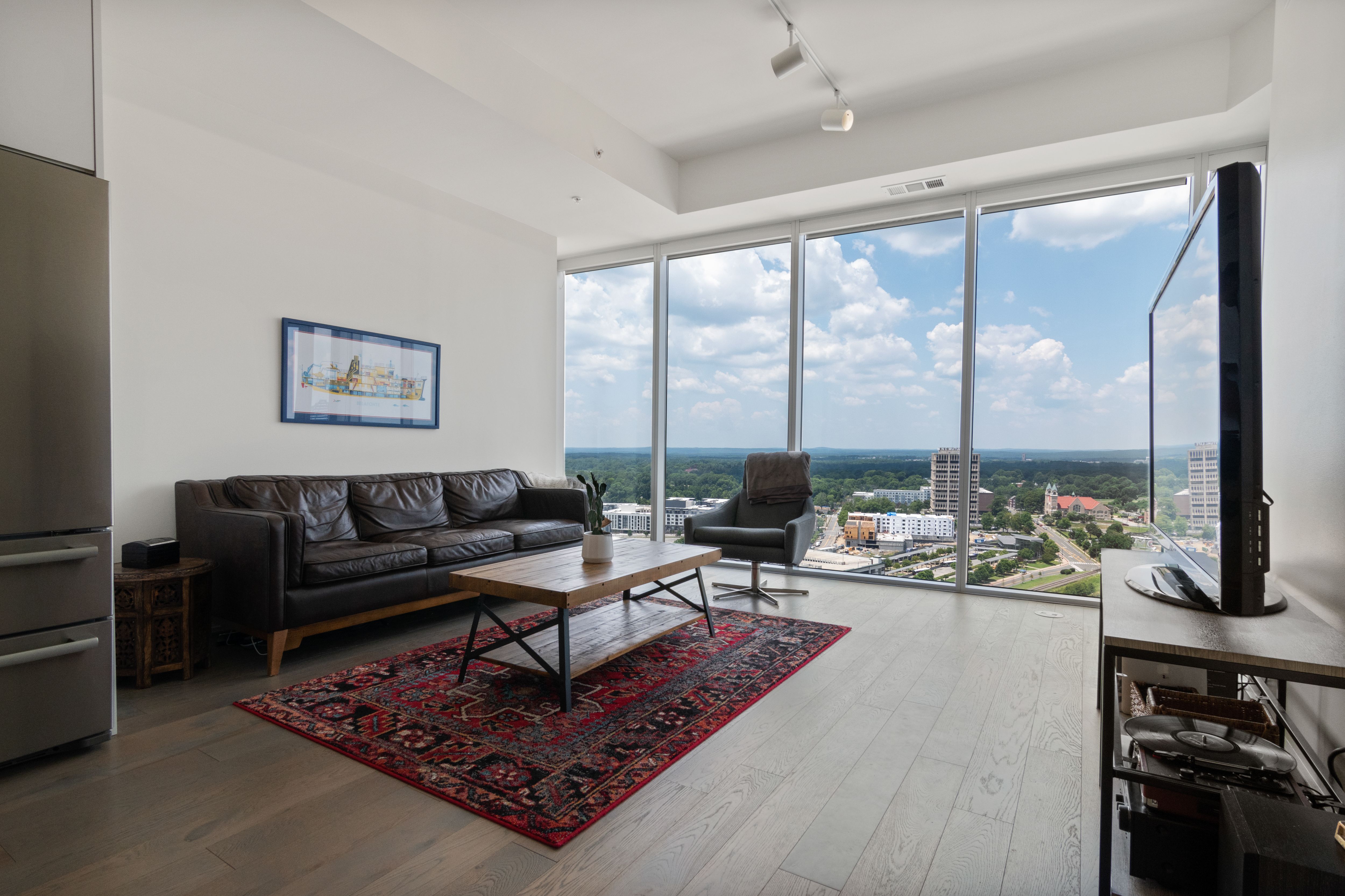 Modern apartment coworking space with floor-to-ceiling windows, ergonomic furniture, and Chicago skyline views - apartments with coworking spaces