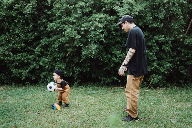 Father Playing Football With Toddler