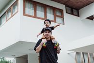 Father Carrying His Son on Shoulders